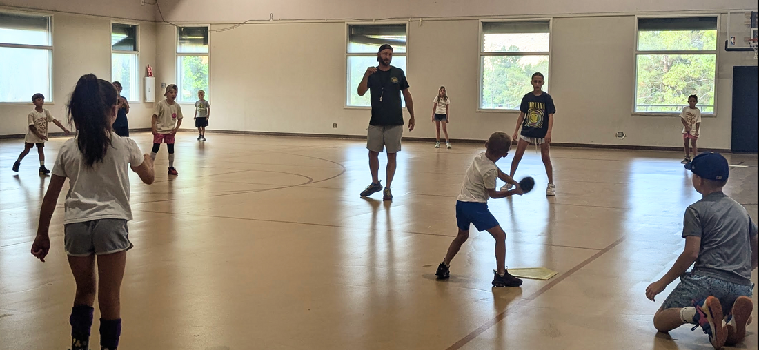 kids playing baseball at youth sports camp in phoenix arizona